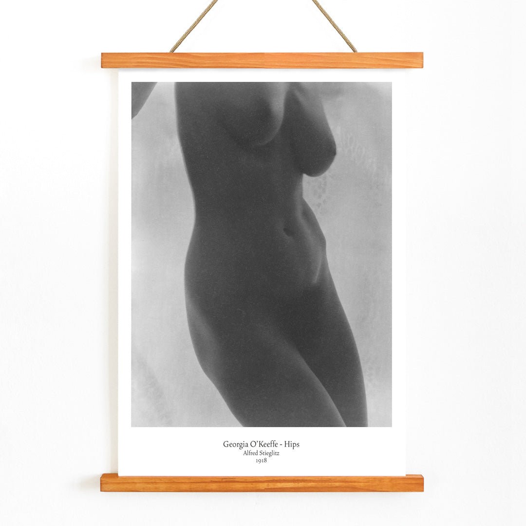 Black and white nude portrait of Georgia O Keeffe Hips by Alfred Stieglitz featuring torso photographic study poster, with wooden magnetic frame on white background
