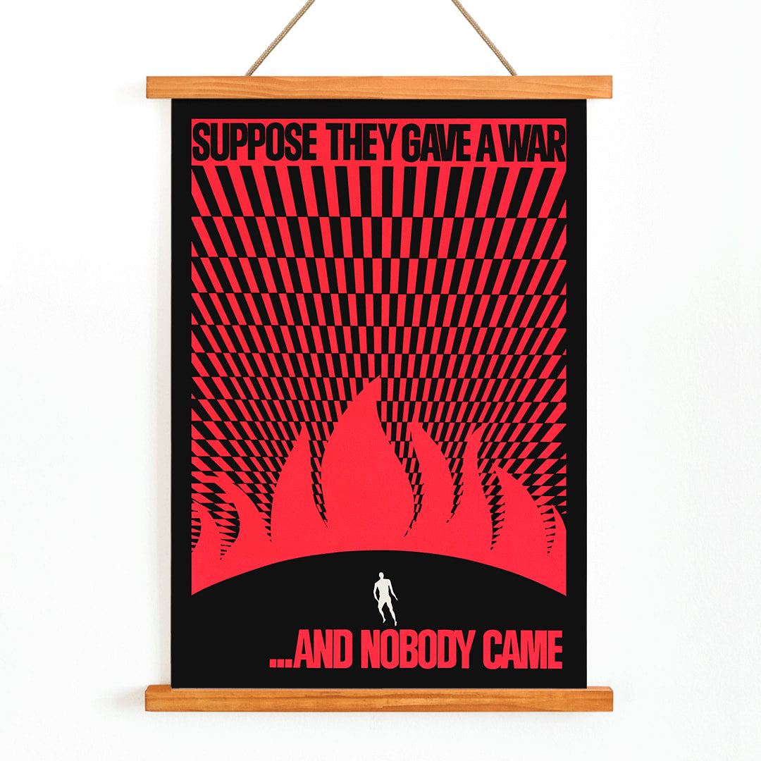 Man on hill facing flames poster by Gary Yanker titled Suppose They Gave a War and Nobody Came Prop art New York, with wooden magnetic frame on white background