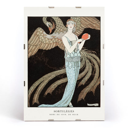 Elegant woman in blue evening dress with majestic bird Sortileges Evening dress by George Barbier art deco poster, framed and displayed in modern living room decor