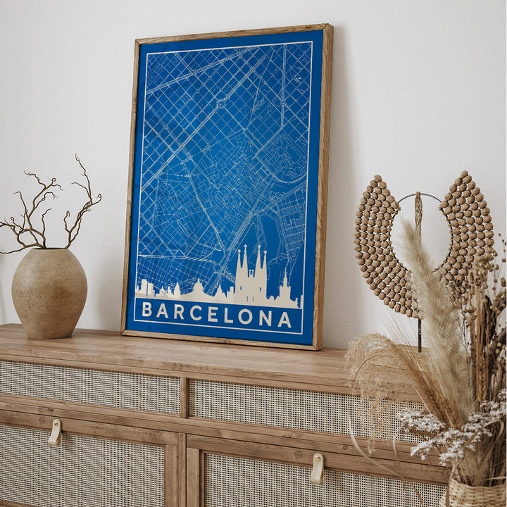Minimalist blue and white map of Barcelona by Moryarty featuring iconic landmarks street layout and skyline poster titled Minimalist Map of Barcelona 2, framed and displayed in home decor