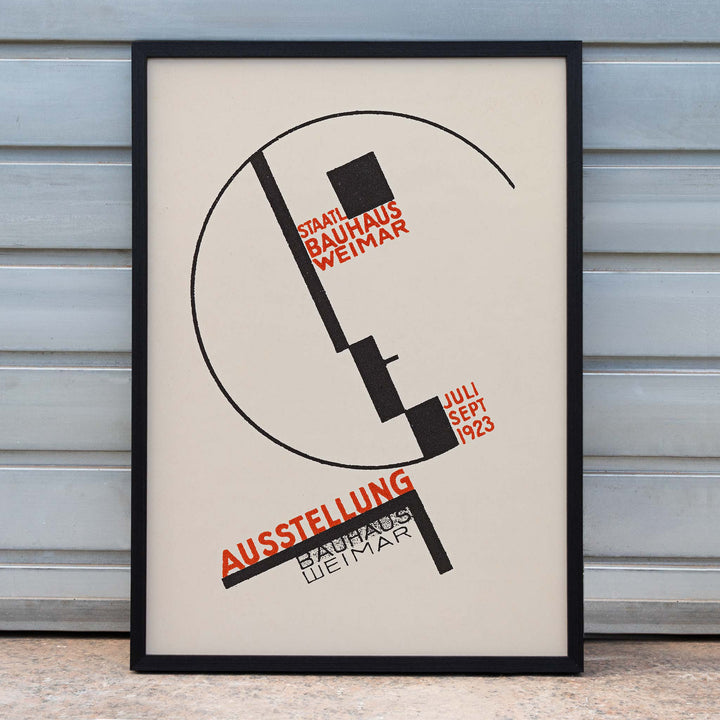Dörte Helm Bauhaus Weimar exhibition poster with bold black geometry and red typography on warm beige background, framed and displayed in home decor