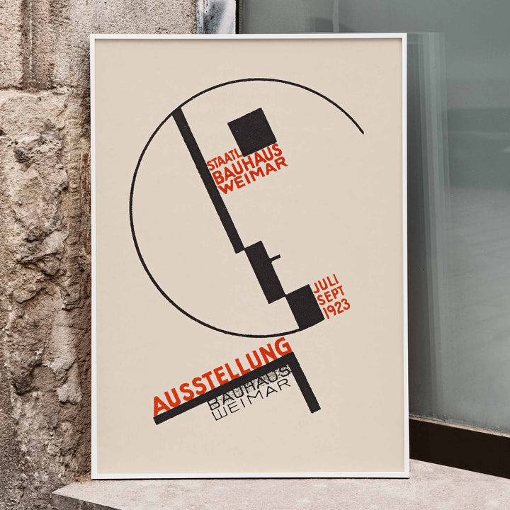 Dörte Helm Bauhaus Weimar exhibition poster with bold black geometry and red typography on warm beige background, framed and displayed in modern living room decor