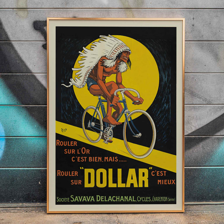 Michel Liebeaux Dollar Bicycles poster with advertising cyclist, white headdress, yellow circle, black background and bold orange lettering, framed and displayed in modern living room decor