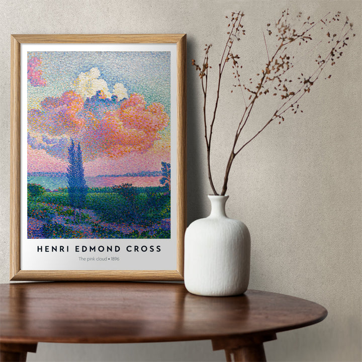Colorful landscape poster with a vivid pink cloud by Henri Edmond Cross titled The Pink Cloud, framed and displayed in home decor
