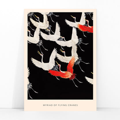 Furisode with a Myriad of Flying Cranes traditional Japanese artwork poster featuring elegant white and red cranes in flight on a black background, framed and displayed in modern living room decor