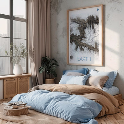 Stunning NASA satellite image of Earth showing snowy mountain ranges and rugged terrain high resolution poster, framed and displayed in home decor