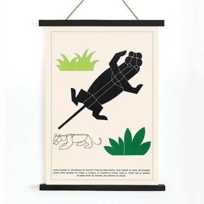 Geometric animal illustrations and poster with plants and geometric shapes forming jungle animals in La Jungle chez moi Pl 04 by Turenne Chevallereau, with wooden magnetic frame on white background