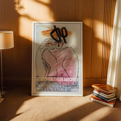 Secret Ahrenberg Collection Exhibition poster by Le Corbusier featuring abstract art with bold lines and vivid colors, framed and displayed in home decor