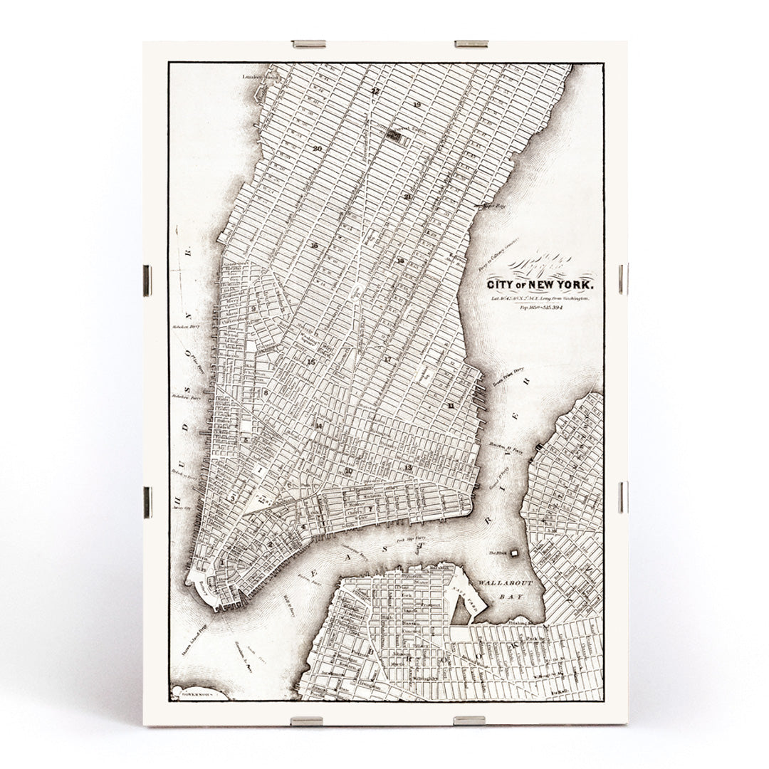 Vintage map of New York City showing detailed streets and layout from Library of Congress Geography and Map Division titled Map of the City of New York, framed and displayed in modern living room decor