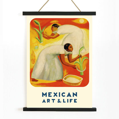 Diego Rivera painting of two women in white dresses harvesting crops in a vibrant orange and yellow field Mexican Art and Life magazine cover poster, with wooden magnetic frame on white background