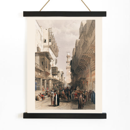 Bustling Cairo street scene with Mosque The Mooristan and people illustrated by David Roberts, with wooden magnetic frame on white background