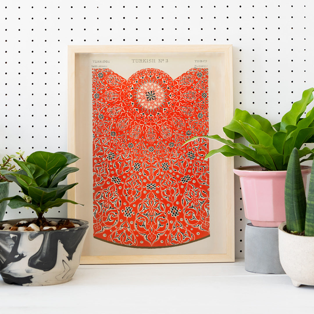 Intricate red and white Turkish ornamental pattern artwork poster by Owen Jones titled Grammar of Ornament featuring detailed geometric designs, framed and displayed in home decor