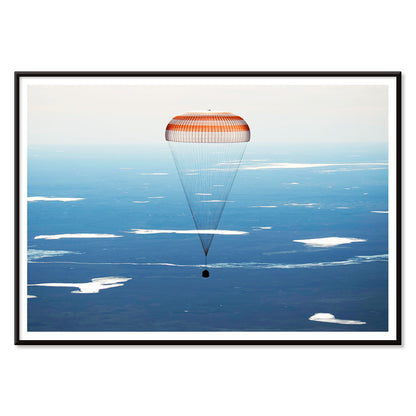 Soyuz MS-02 spacecraft descending with parachute over Kazakhstan NASA poster artwork showing landing, with black aluminium frame on white background