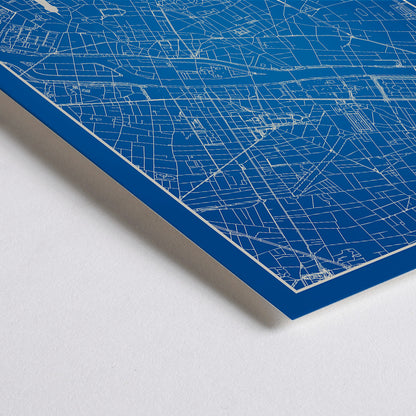 Closeup detail of Minimalist Paris city map artwork and poster featuring detailed blue and white map with Eiffel Tower and prominent Paris landmarks