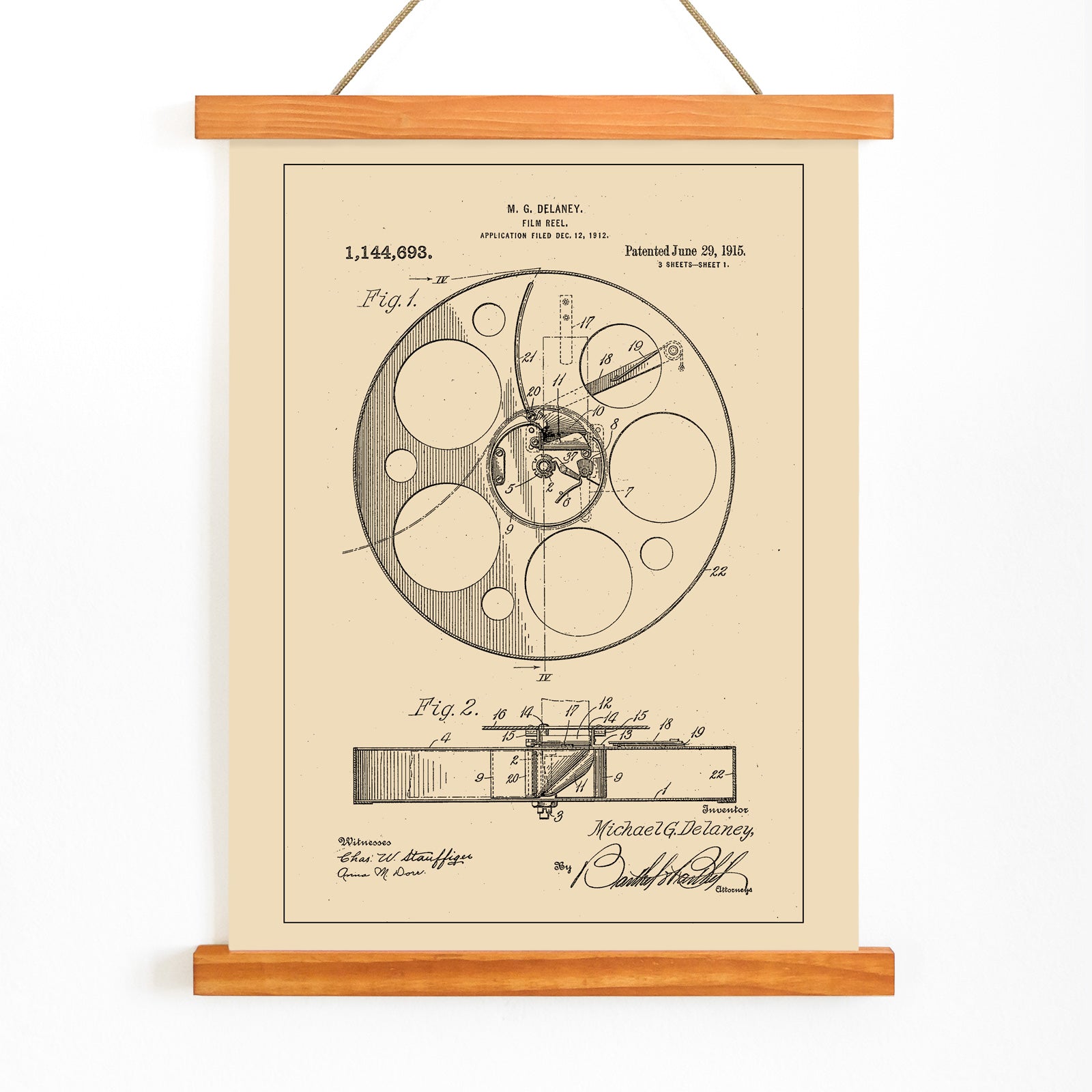 Vintage film reel patent illustration and schematic artwork by M G Delaney for wall art decor, with wooden magnetic frame on white background