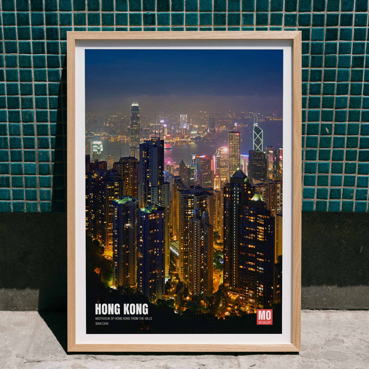 Hong Kong Nightview by Mo Art Gallery featuring a vibrant illuminated city skyline and skyscrapers at night, framed and displayed in home decor