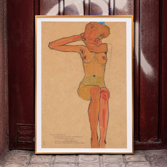 Seated female nude in expressive style Mädchenakt Gertrude by Egon Schiele poster featuring a nude figure in a seated pose with expressive lines and color, framed and displayed in home decor