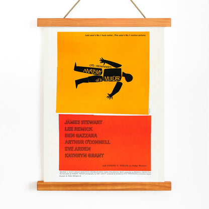 Movie poster of Anatomy of a Murder by Saul Bass features a yellow and red design with a black silhouette of a body, with wooden magnetic frame on white background