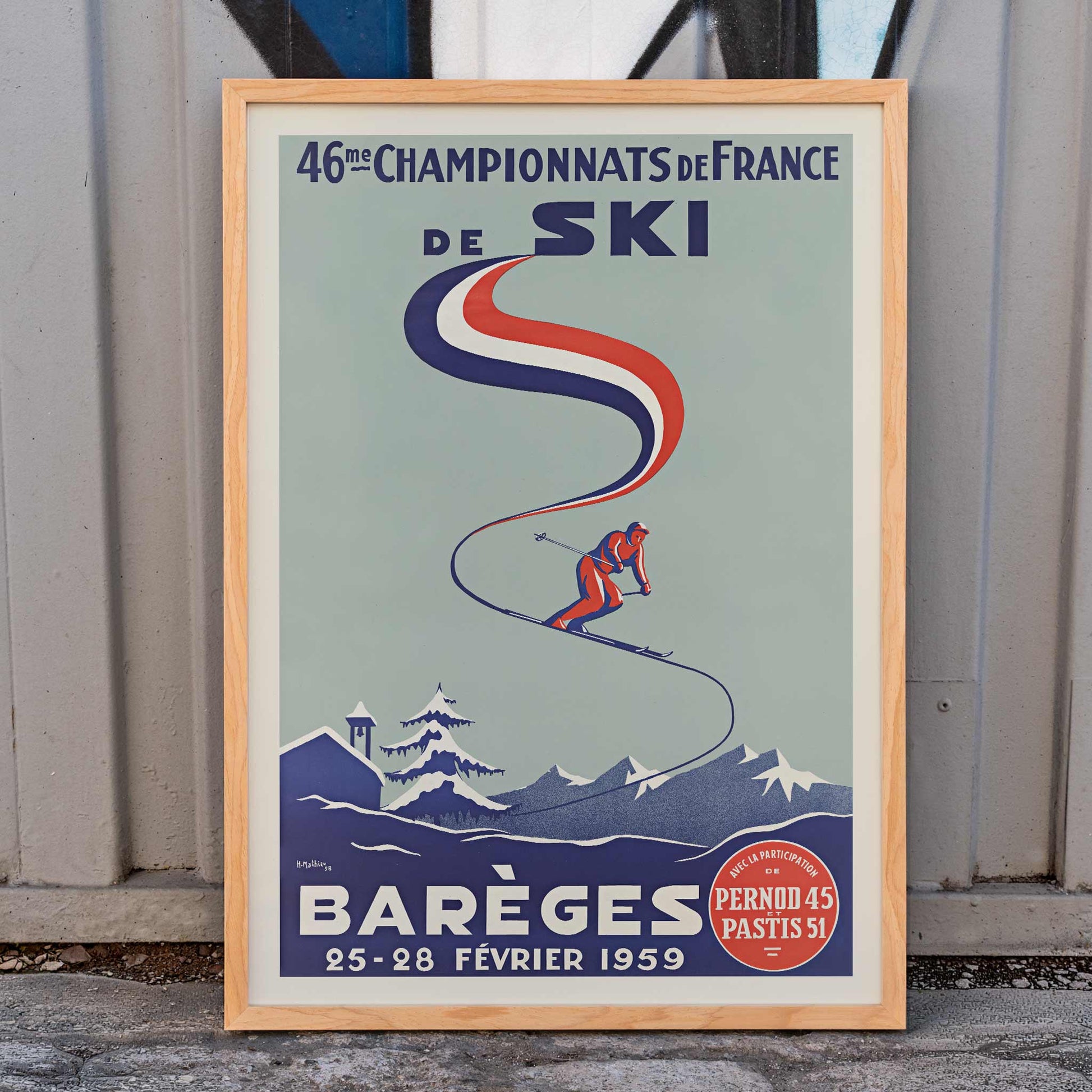 H. Mathieu French Ski Championships poster for Barèges with alpine skier, blue slopes, red and white ribbon graphics, snowy mountains, framed and displayed in home decor