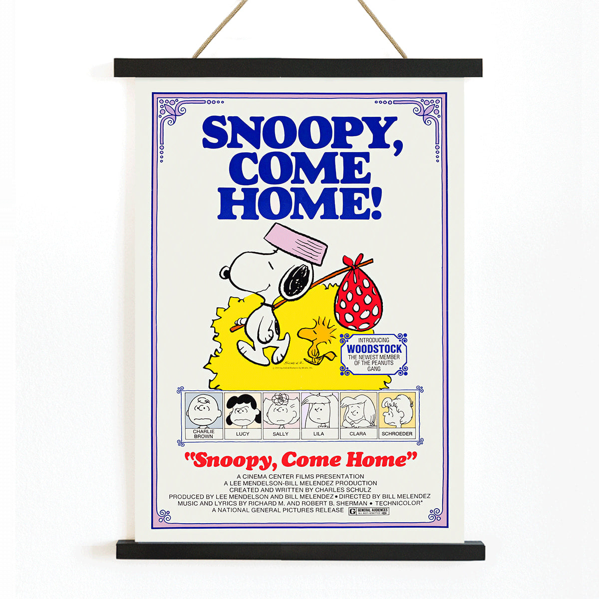 Snoopy Come Home movie poster by Charles Schulz featuring Snoopy Woodstock Lucy and Charlie Brown in colorful Peanuts illustration, with wooden magnetic frame on white background