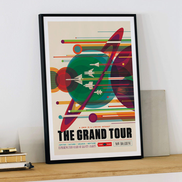 Retro space travel poster The Grand Tour by NASA featuring colorful planets and retro spaceships ideal for space exploration fans, framed and displayed in modern living room decor