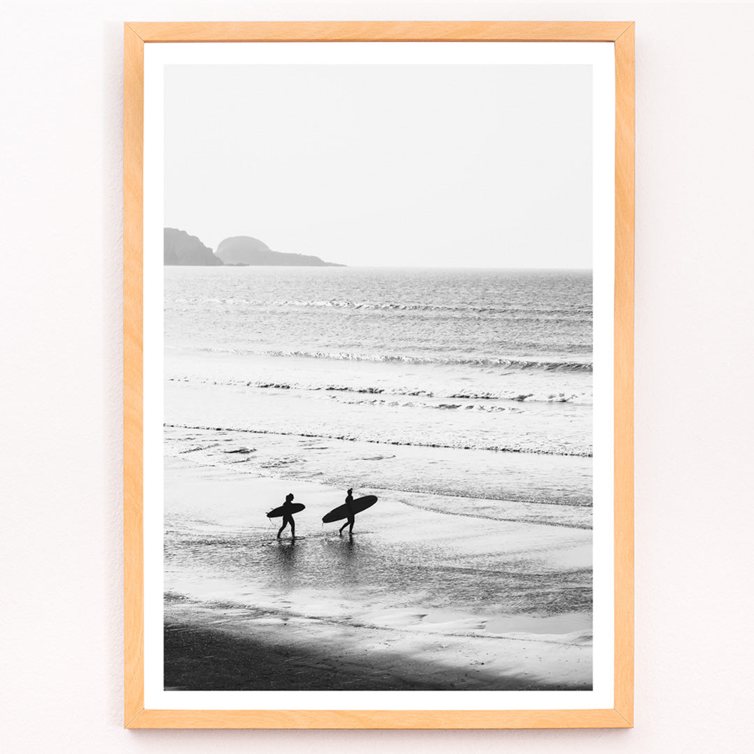 Closeup detail of Black and white poster of surfers walking along the beach Surfers walking on the beach artwork