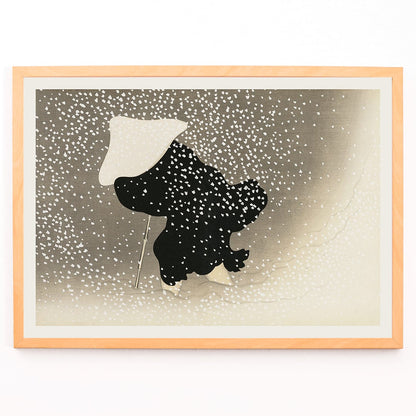 Poster of Tomoe no yuki by Kamisaka Sekka showing a snowy scene with a silhouette of a figure in dark attire under heavy snowfall wearing a white hat and holding a walking stick, framed and displayed in modern living room decor