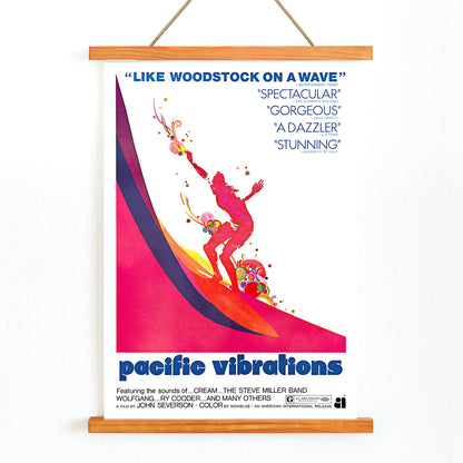 Pacific Vibrations surfing documentary poster by John Severson featuring colorful surfer illustrations and a surfer riding a wave, with wooden magnetic frame on white background