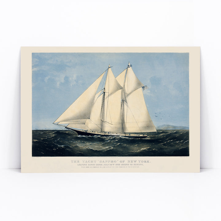 Chromolithograph artwork of Yacht Sappho sailing on the ocean by Currier and Ives poster showing sailing yacht at sea titled Chromolithograph of the yacht Sappho of New York, framed and displayed in modern living room decor